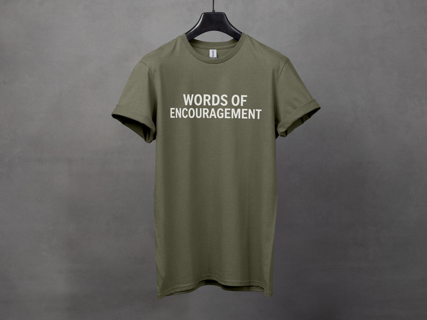 Olive green t-shirt with white text "WORDS OF ENCOURAGEMENT".