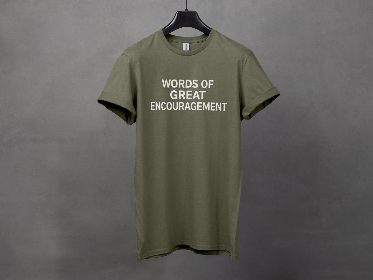 Olive green t-shirt with white text that reads "WORDS OF GREAT ENCOURAGEMENT."
