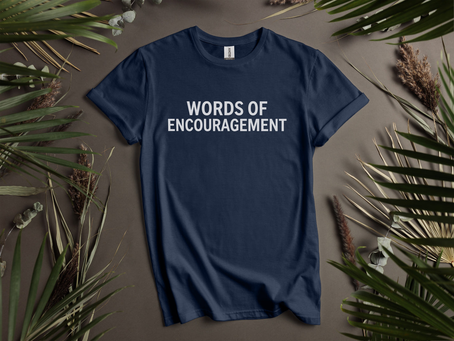Navy blue t-shirt with "WORDS OF ENCOURAGEMENT" printed in white.