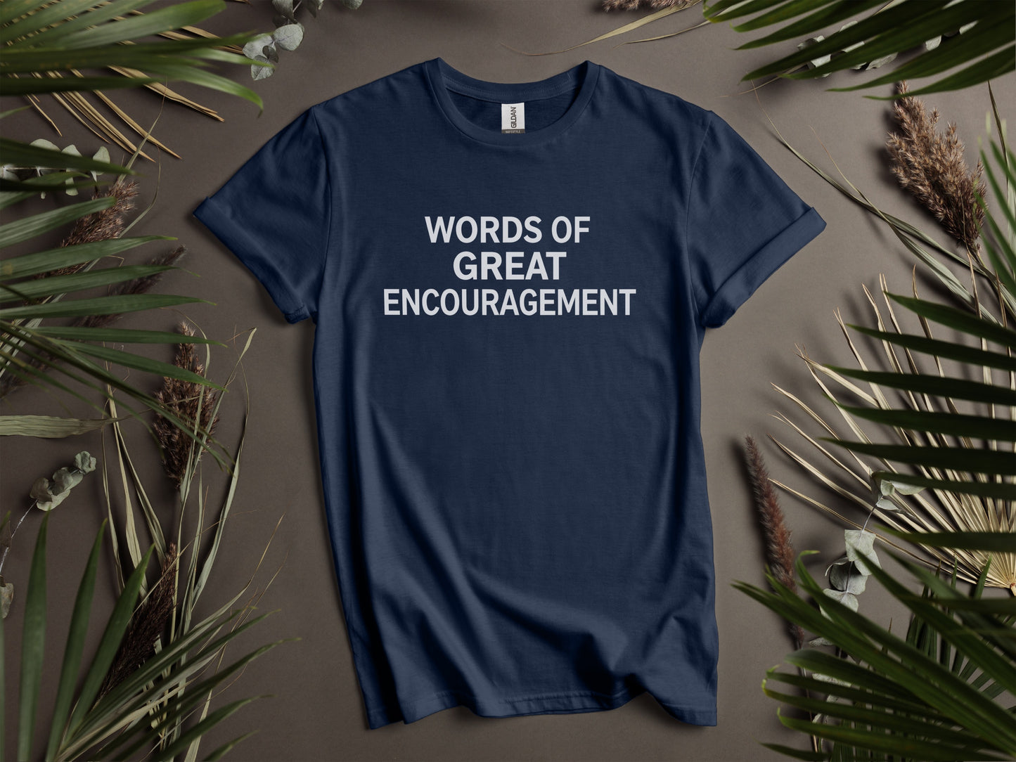 Navy t-shirt with white text reading "WORDS OF GREAT ENCOURAGEMENT".